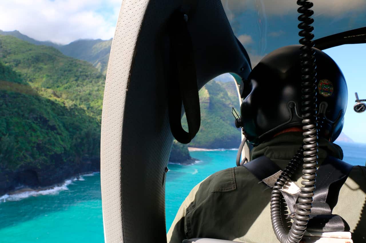 A Coast Guard search and rescue team looking over Napali Coast State Wilderness Park as part of the search for the crashed helicopter. 