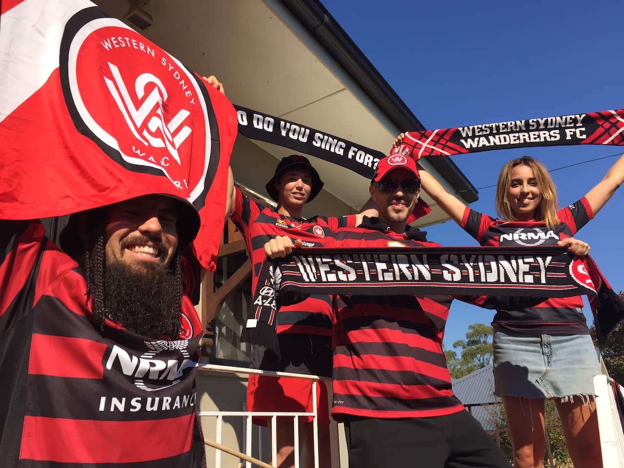 HektiK Hektor (left) with fellow fans heading to Adeladie for the Grand Final