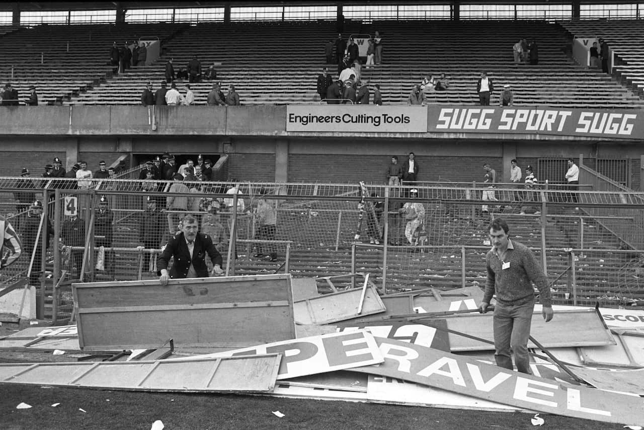 Advertising boards which were used as stretchers piled up at Hillsborough in the aftermath of the tragedy. (AAP)