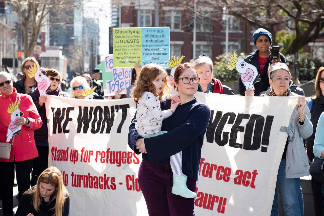 Supporters of a Tamil asylum seeker family rally to stop their eminent deportation at the State Library of Victoria, Melbourne, Sunday, August 25, 2019. 