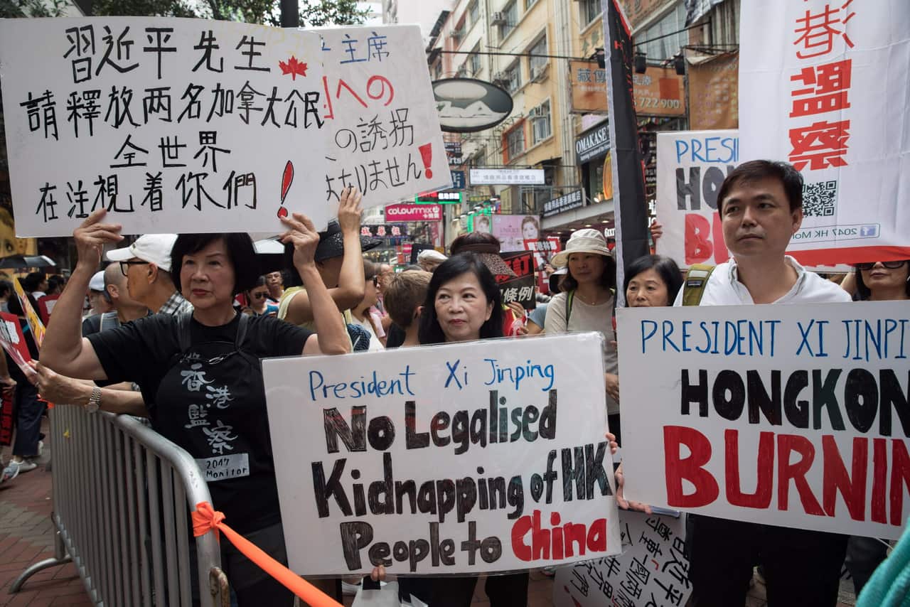 Pro-democracy activists take part in a march against a proposed extradition law in Hong Kong.
