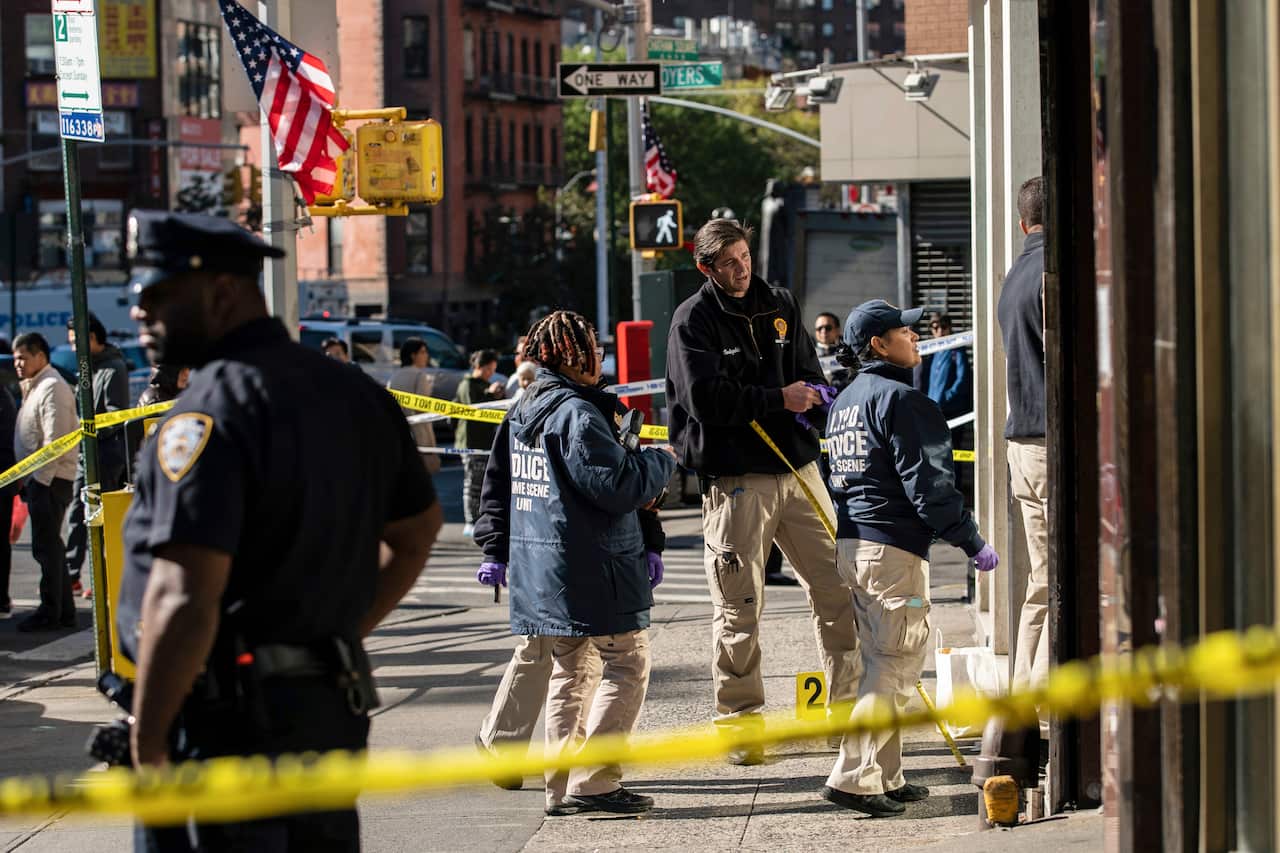 New York Police Department officers at the scene of the attack in Manhattan's Chinatown neighborhood.