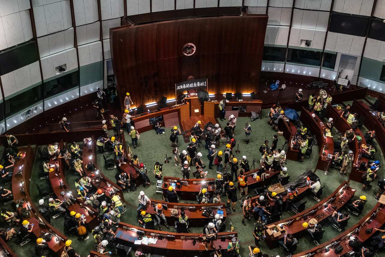Protesters occupy the Legislative Council in Hong Kong, July 1, 2019. Roy Kwong has emerged as a hero for the city’s youth and a leading voice for moderation during the political crisis there. (Lam Yik Fei/The New York Times)