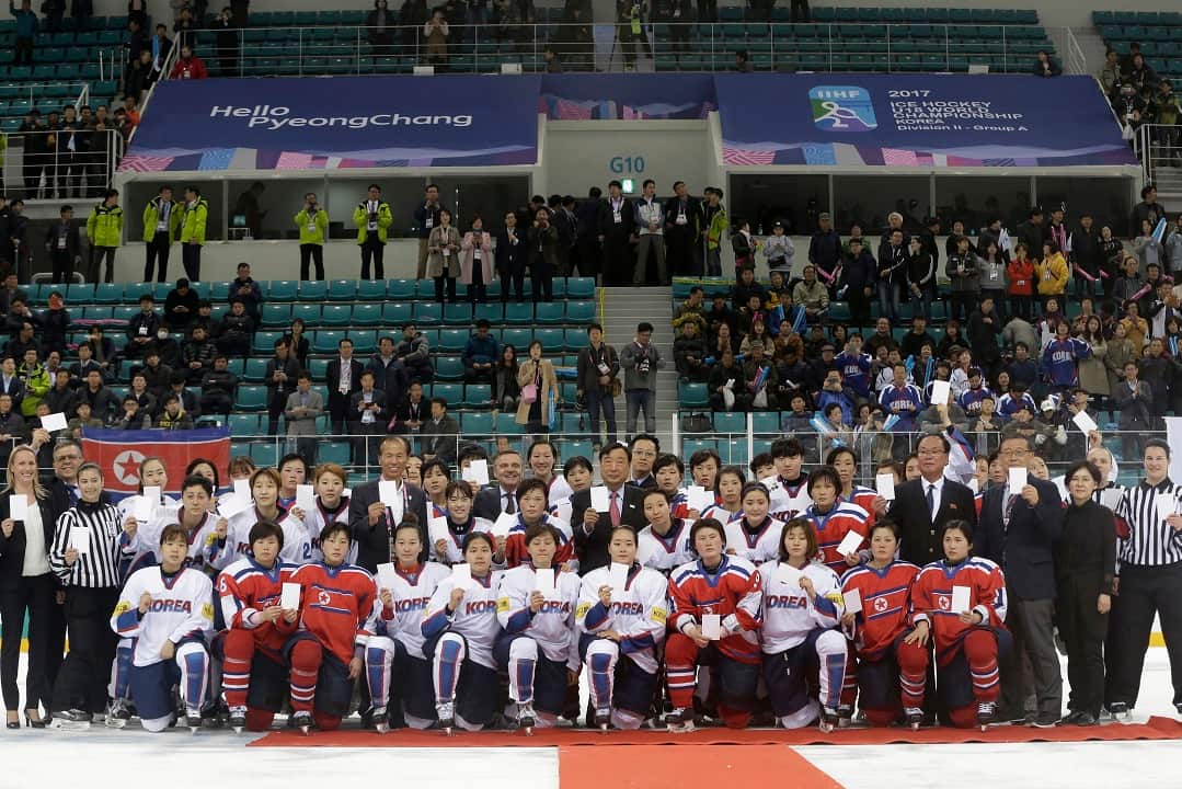 April 6, 2017: Women's ice hockey players from South Korea, white, and North Korea, red, at the Ice Hockey Women's World Championship.