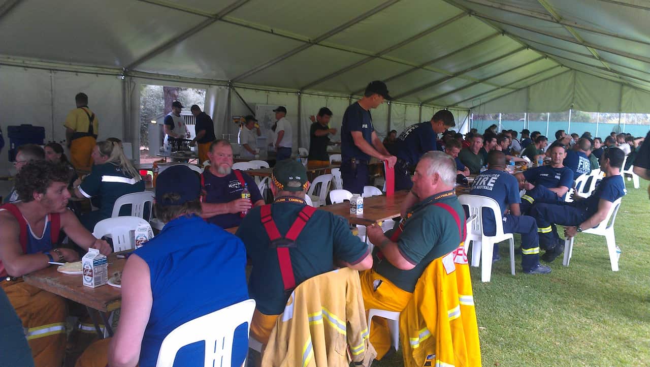 Crews from NSW and Victoria have a sit-down meal before heading home. (Karen Ashford)