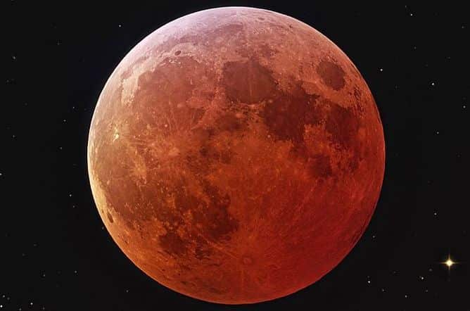 The moon turning red during an eclipse, also known as a blood moon. NASA
