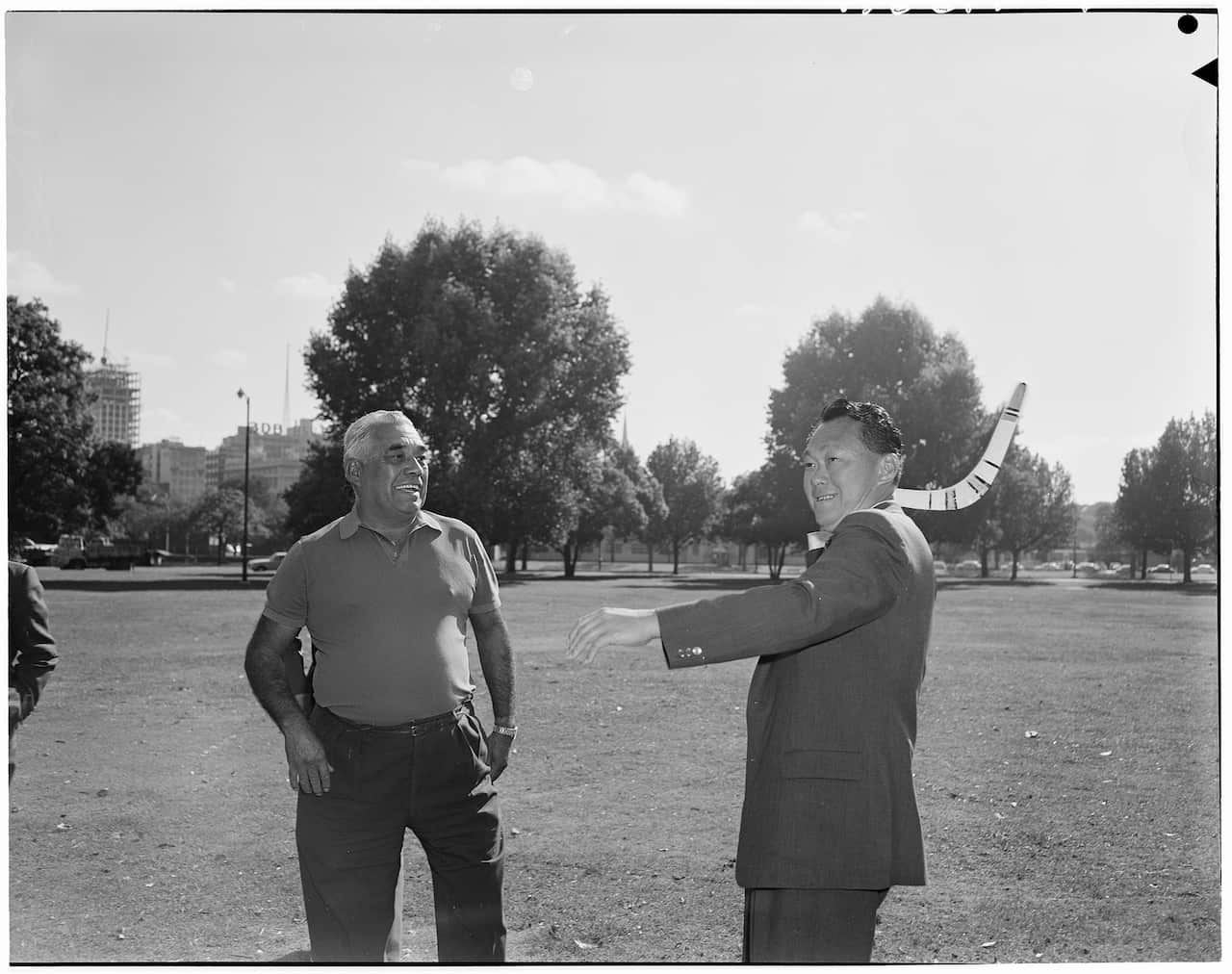 A visit by former Singapore PM Lee Kuan Yew to Canberra prior to independence, seen having a  boomerang lesson. (National Archives of Australia)