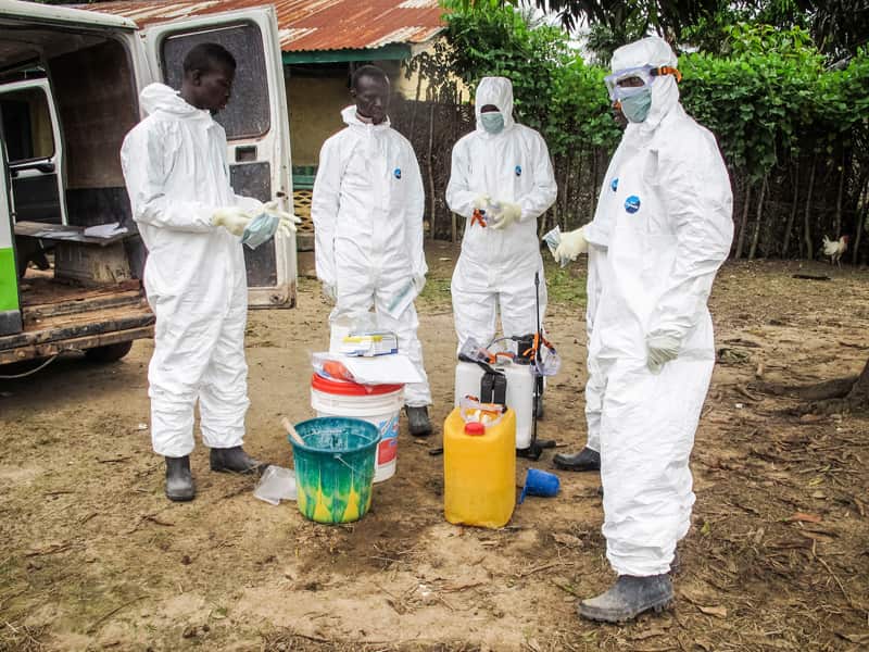 Health workers wear protective gear