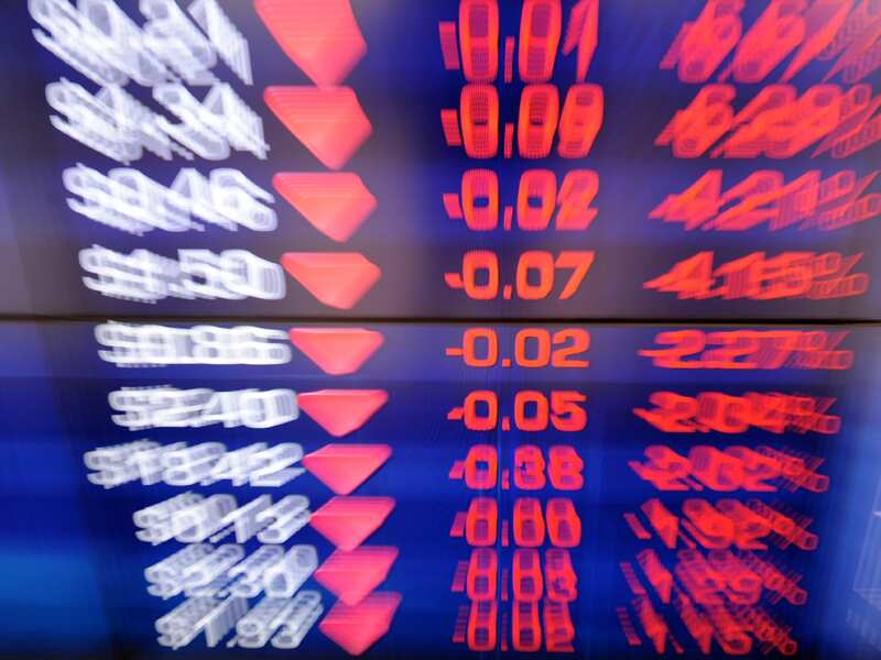 A screen displays stock market.