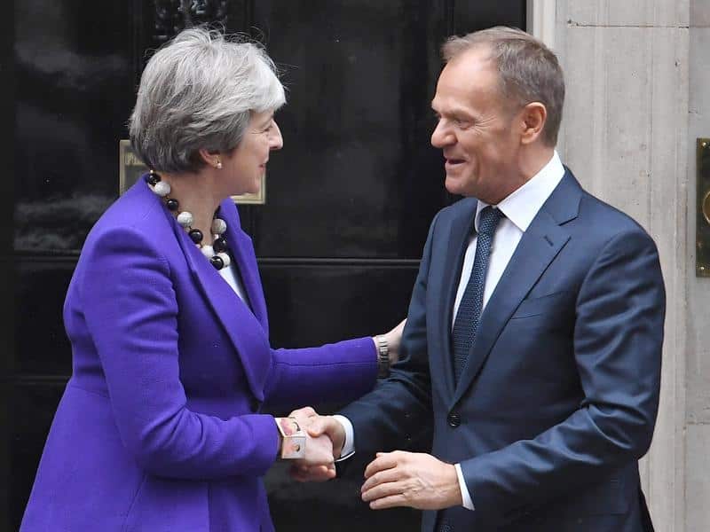 British Prime Minister Theresa May, pictured here with European Council President Donald Tusk, is seeking more time. 