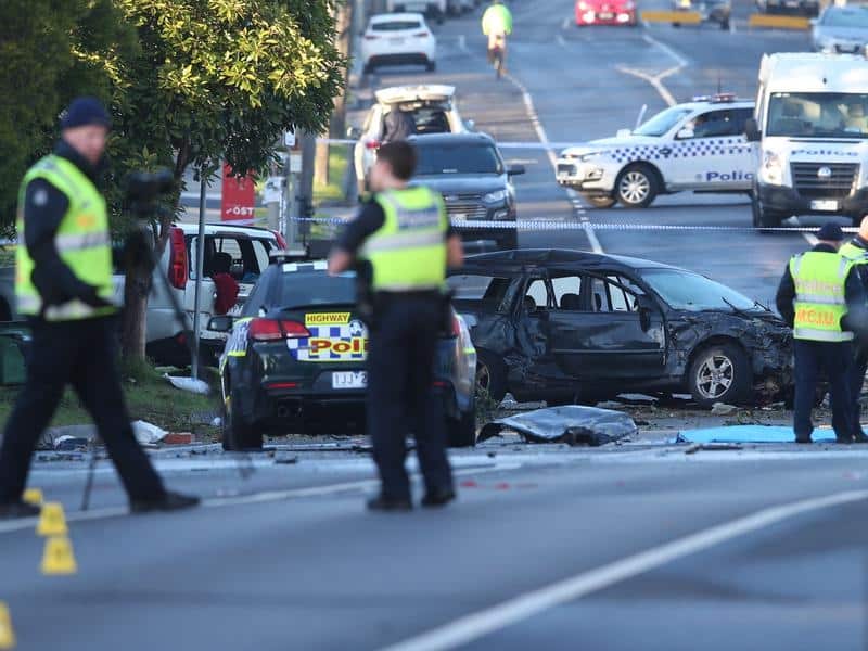 Police detectives at the scene of a fatal crash in Northcote