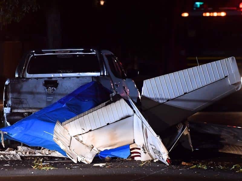The plane tore down powerlines as it came down and caught fire on a Melbourne suburban street.