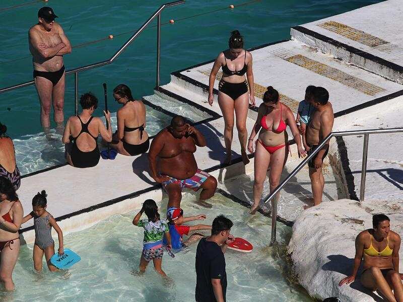 Beachgoers are seen at Bondi Beach, Sydney.