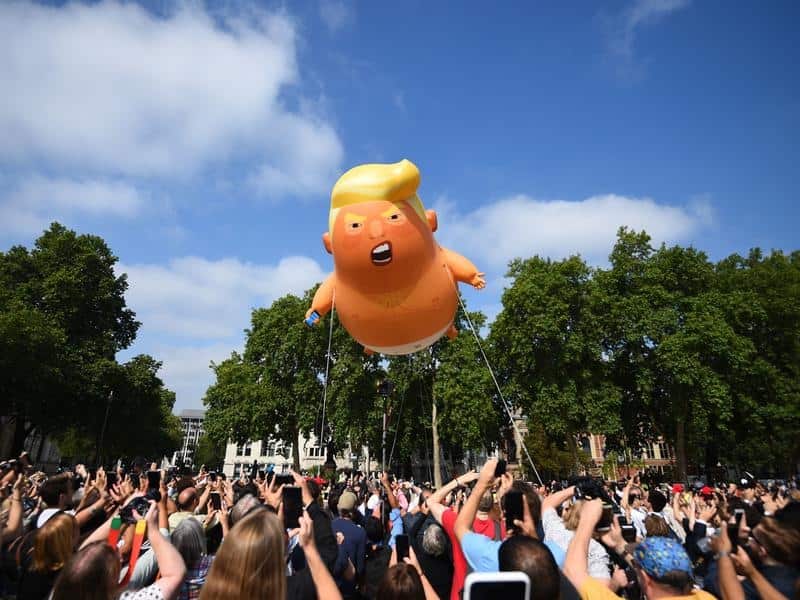 A 'Baby Trump' blimp hovers above protesters in London.