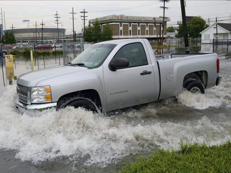 A truck passes floodwater near the New Orleans Superdome.