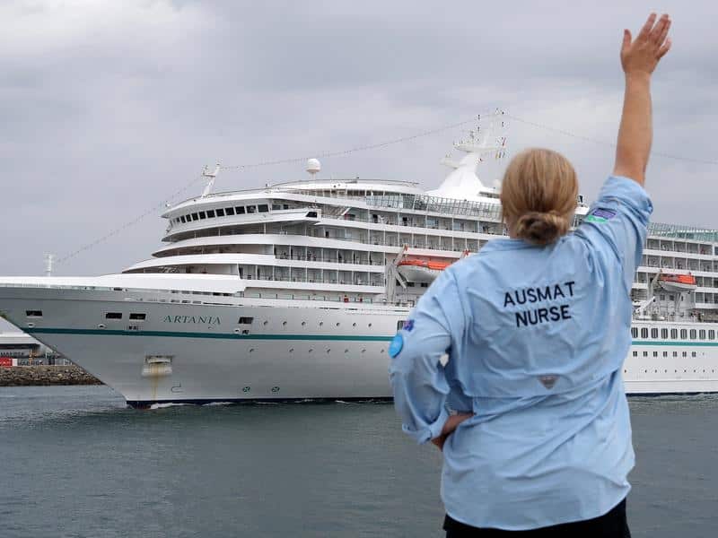 AUSMAT staff waving at the Artania cruise ship.