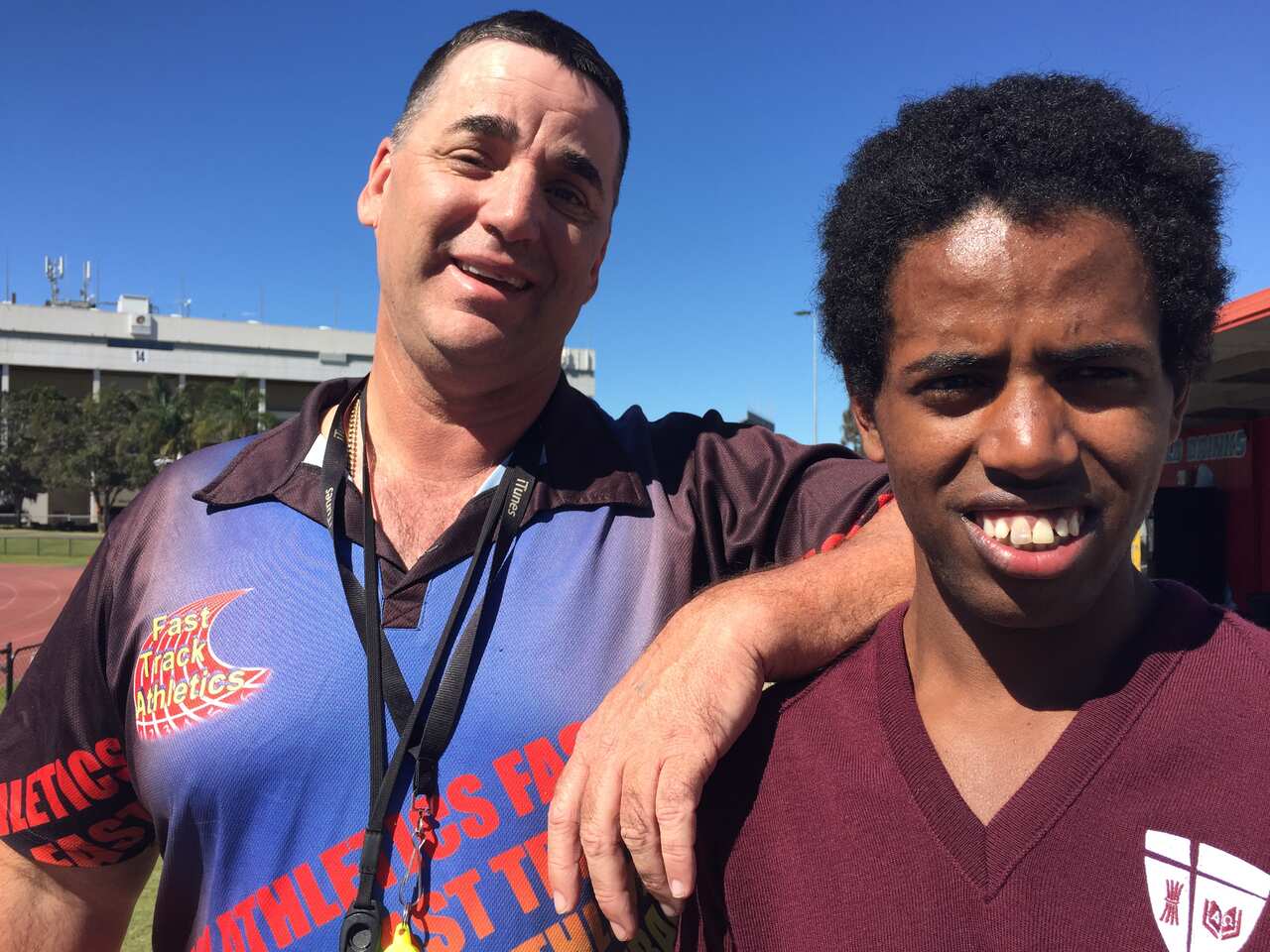 Ethiopians refugee Chekole Gentenet (right) with trainer and president of Fast Track Athletics, Murray Watkins (left), in Brisbane ahead of the Australian Cross Country Championships at Moonee Valley Racecourse, Melbourne on Saturday 29 August 2015.