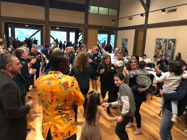The Eltham community celebrate the end of the successful resettlement program.  