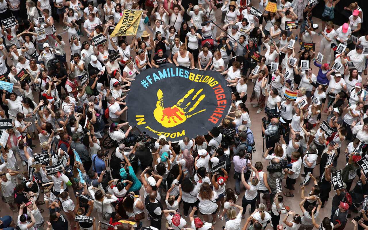 Protesters that marched from Freedom Plaza to the US Capitol demonstrate inside the Hart Senate Office Building against family detentions.