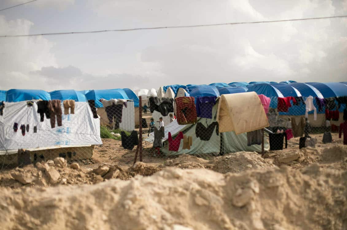 In this Sunday, March 31, 2019, file, photo, laundry dries on a chain link fence in an area for foreign families, at Al-Hol camp in Hassakeh province, Syria (AAP)