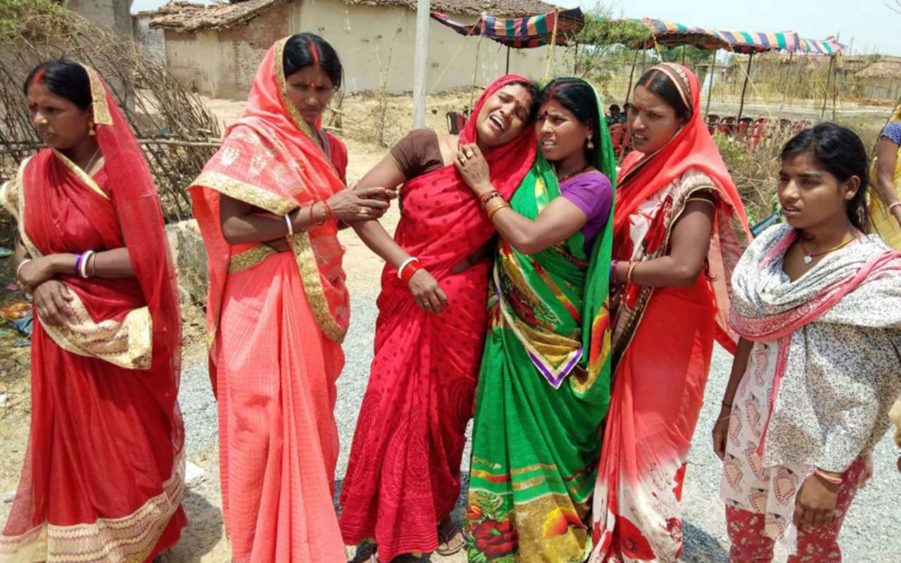 Indian relatives mourn following the rape and murder of a 16-year-old girl on May 3