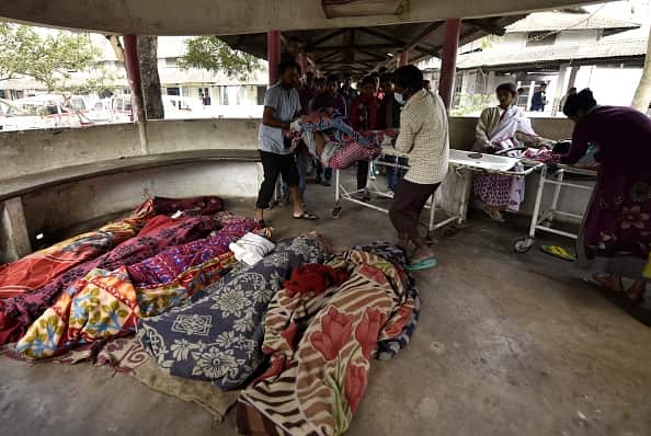 The bodies of people killed by drinking toxic bootleg liquor are gathered together at Kushal Konwar Civil Hospital.