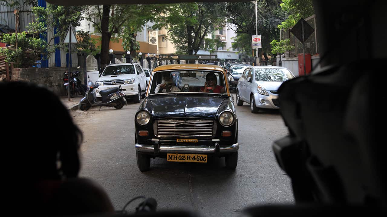 Rajani goes out on an investigation with driver Kalim, in a behind the scenes picture from Dateline's shoot.