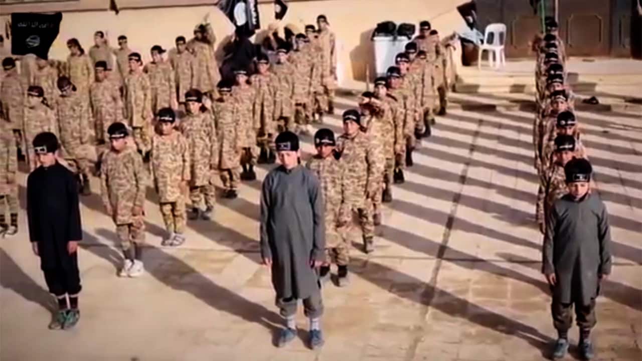 The IS videos show large groups of children being trained.