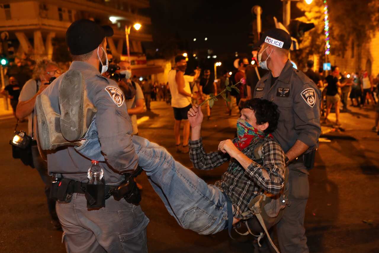 Israeli police arrest a protester during a protest against Prime Minister Netanyahu (AAP)