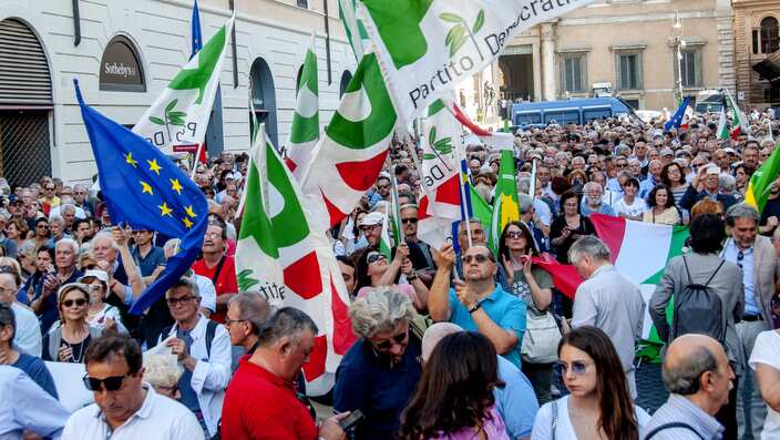 People gather in central Rome after the swearing in ceremony of the new government at Quirinale Palace.