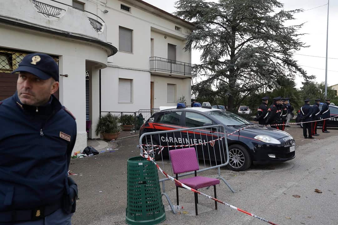Carabinieri officers stand in front of the disco 'Lanterna Azzurra' in Corinaldo where at least six people, all but one of them minors, were killed.