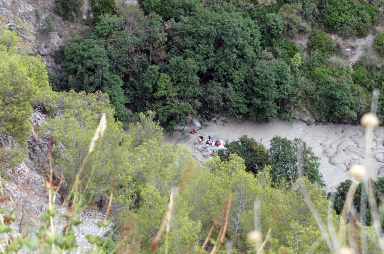 A general aerial view showing rescuers at work in the Gorge of Raganello where the flash flood claimed eight victims, in Civita, southern Italy, 20 August 2018.