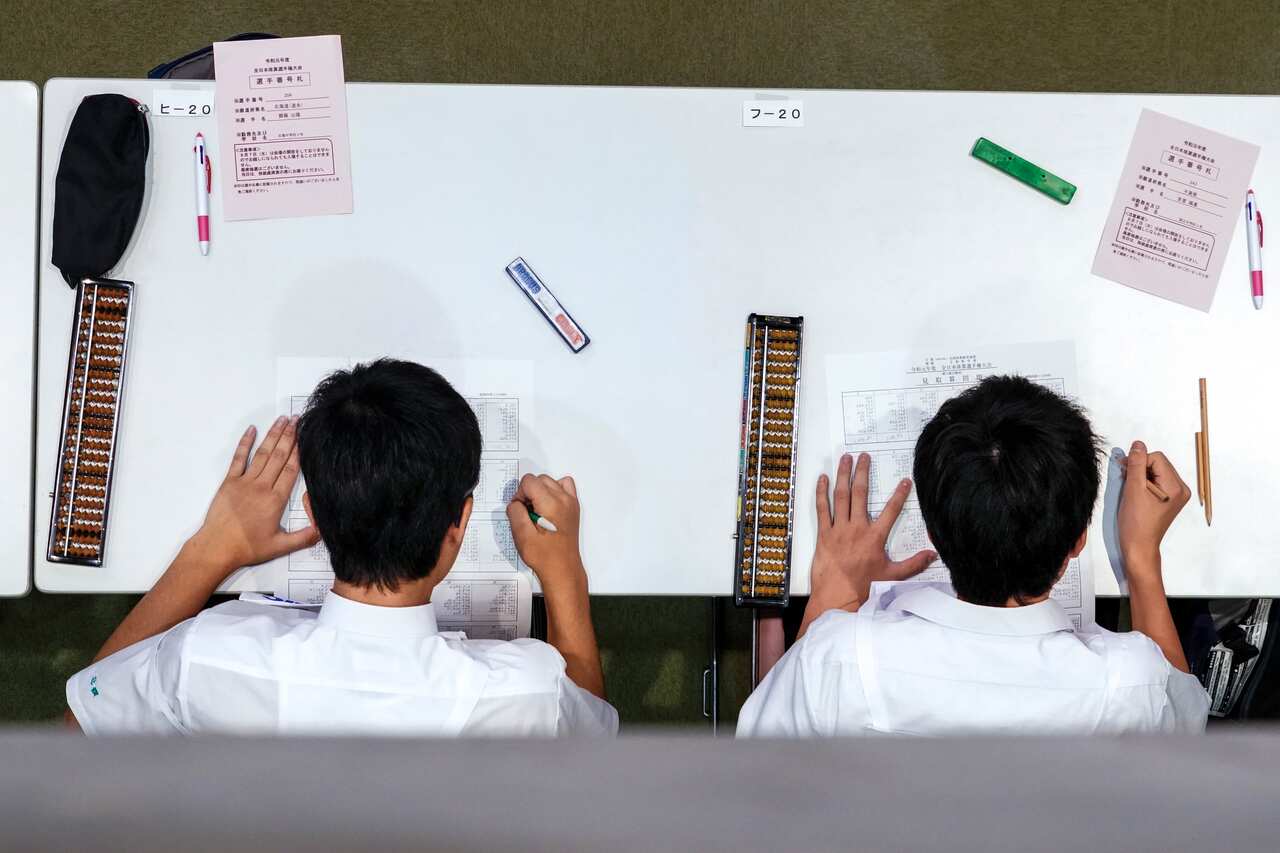 Students concentrating on their calculations in Kyoto, Japan, Aug. 8, 2019. (Chang W. Lee/The New York Times)