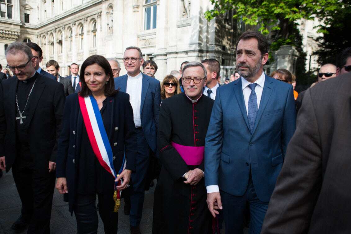 Jean-Marc Chauve, French Interior Minister Christophe Castaner, Paris prefect Didier Lallement, Paris mayor Anne Hidalgo, and other officials walk by Notre Dame cathedral on April 18, 2019 in Paris (AAP)
