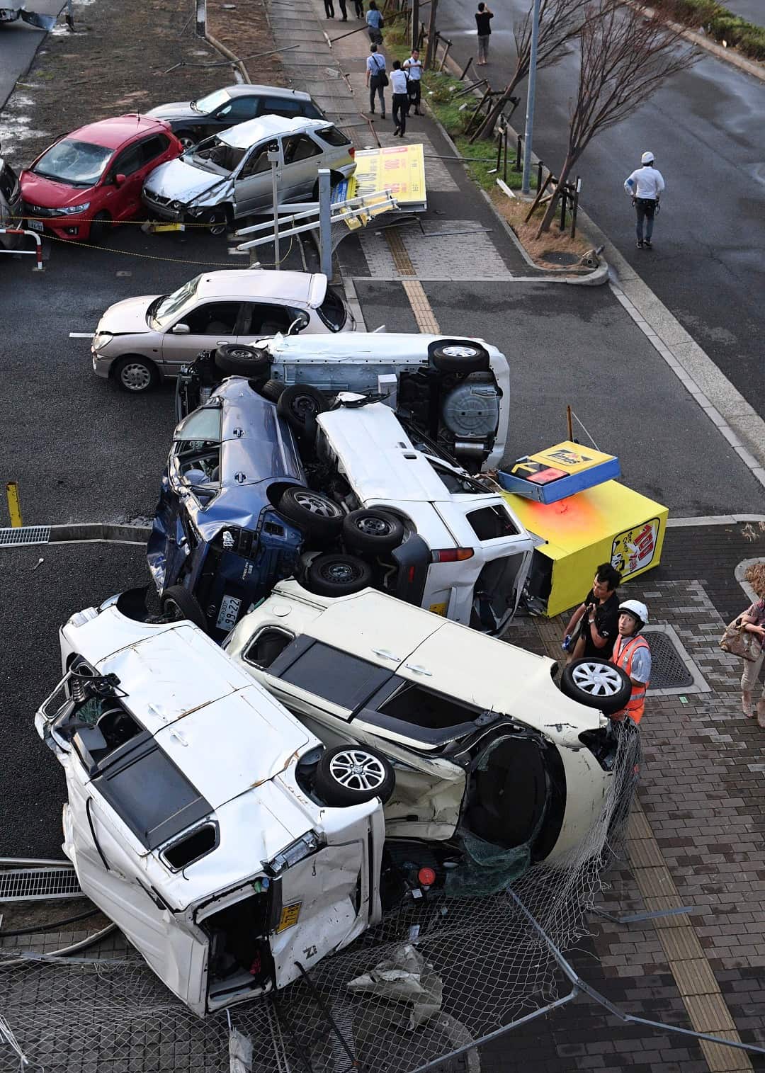 Vehicles were overturned by strong winds.