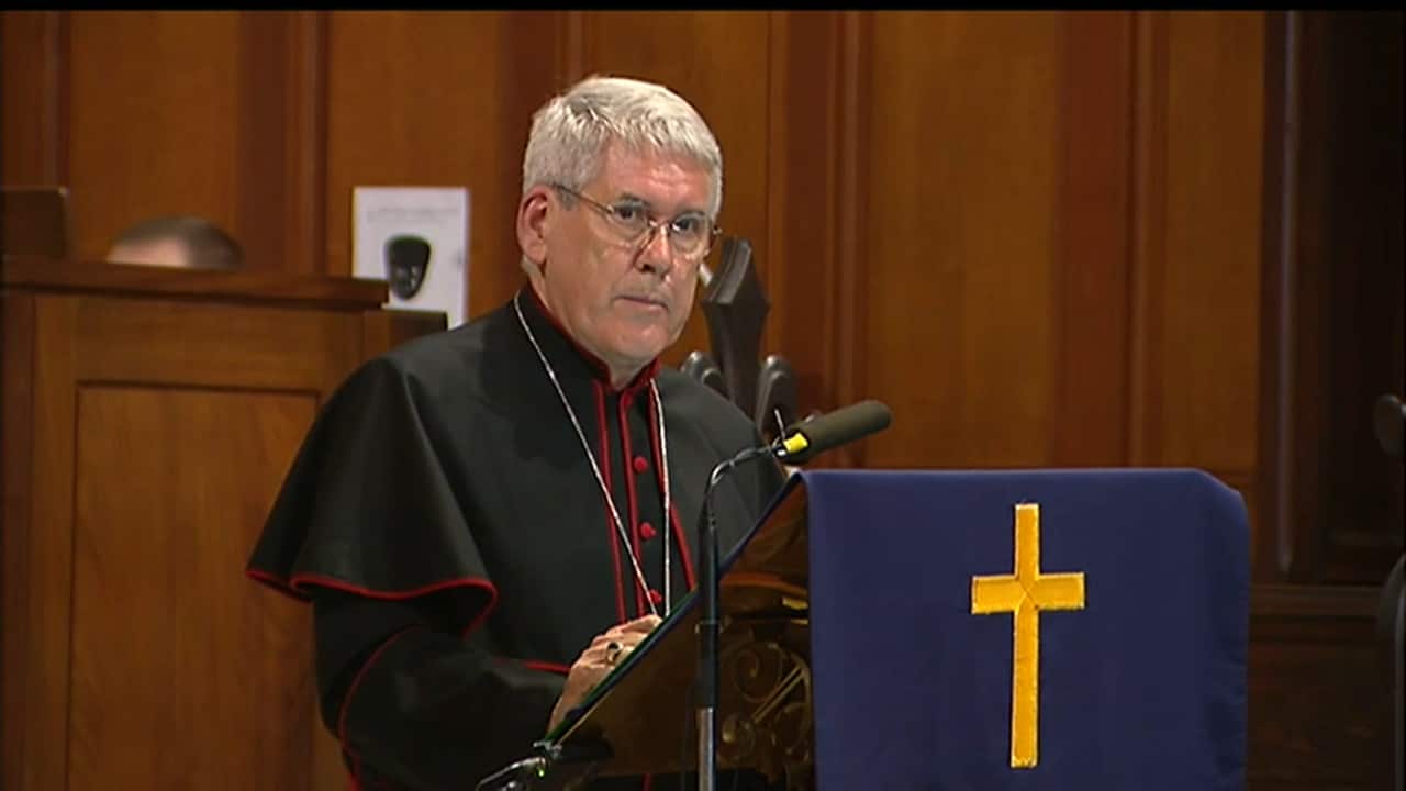 Christ Church Cathedeal Dean Dr Gregory Jenks delivers a prayer during the vigil.