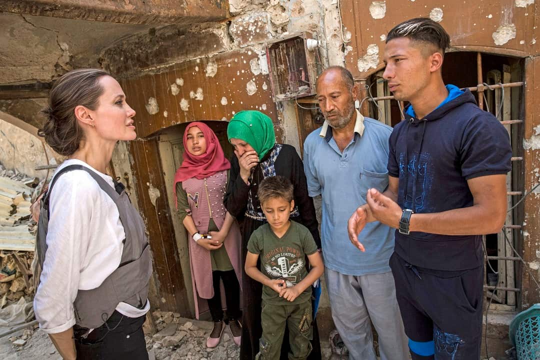 Angelina Jolie meets Mohamed and his family, during a visit to the Old City in West Mosul, Iraq.
