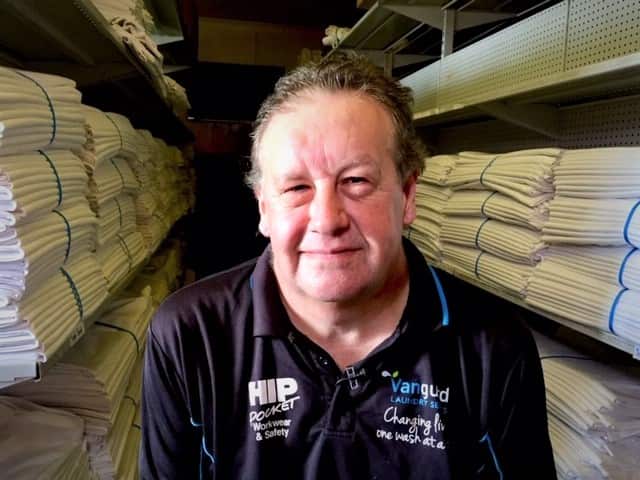 Employee Job Mitchell says working at Vanguard Laundry has changed his life.