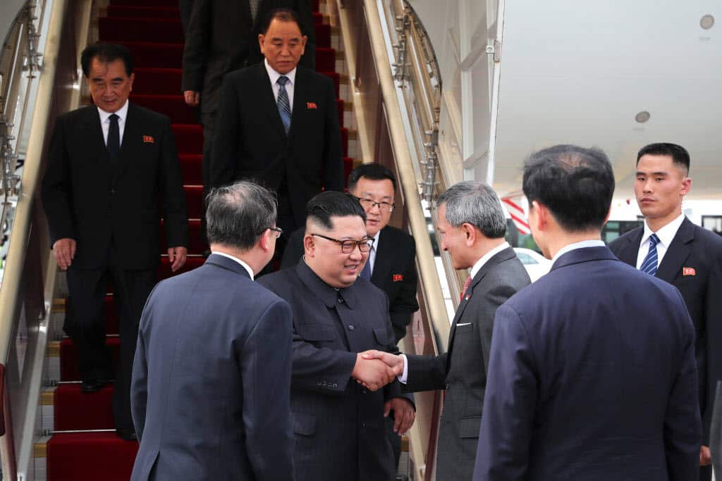 North Korean leader Kim Jong-un (5th from right) welcomed by Singapore's Foreign Minister Vivian Balakrishnan (3rd from Right) at Changi Airport in Singapore.