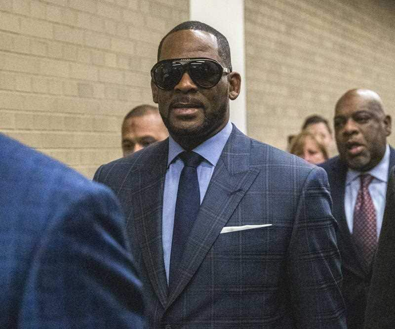 Singer R.Kelly - real name Robert Kelly - arrives at court earlier this year. 