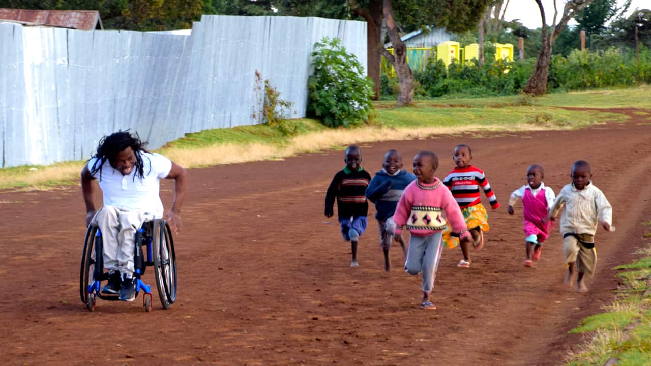 Former Paralympian Ade races with children in Iten, the training ground of many champions. He hopes things will be better for the next generation.