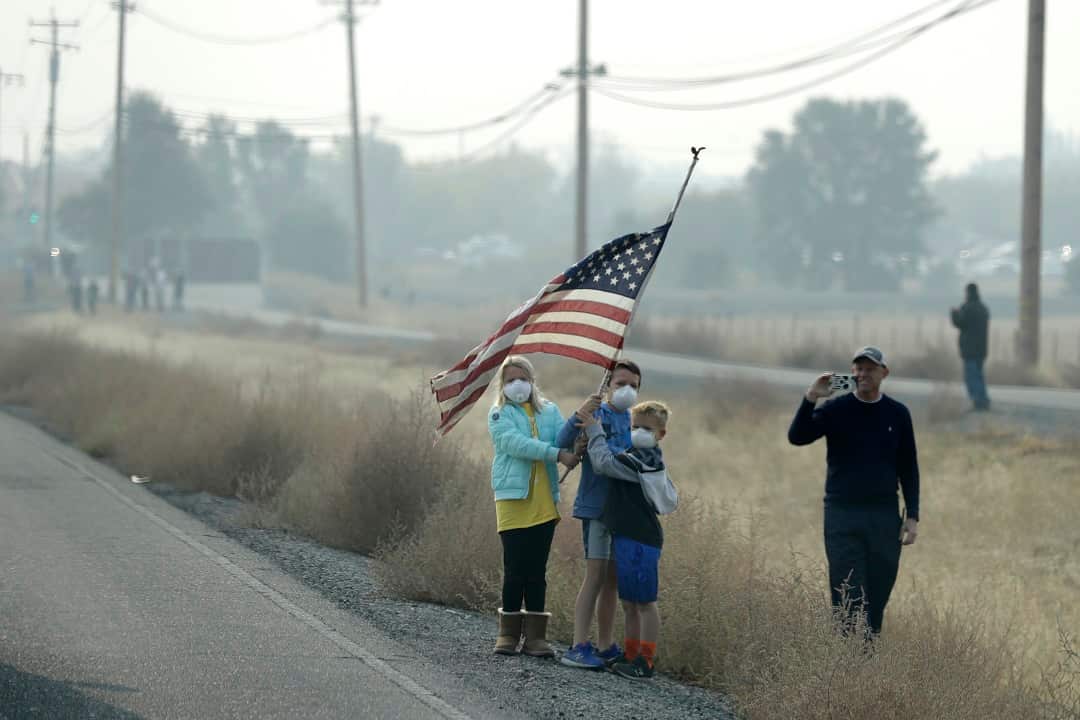 American flag for Donald Trump as his motorcade drives through Chico, California.
