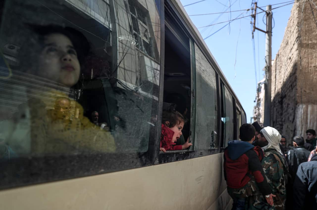 Women and children packed buses to take them out of Eastern Ghouta. 