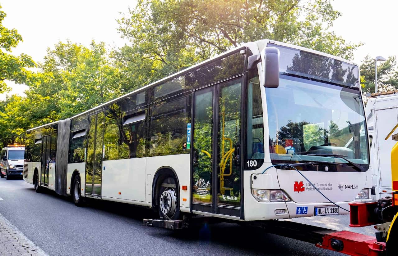 The bus is being towed away at the scene where a person had reportedly attacked passengers on a bus in Luebeck, Germany, 20 July 2018.