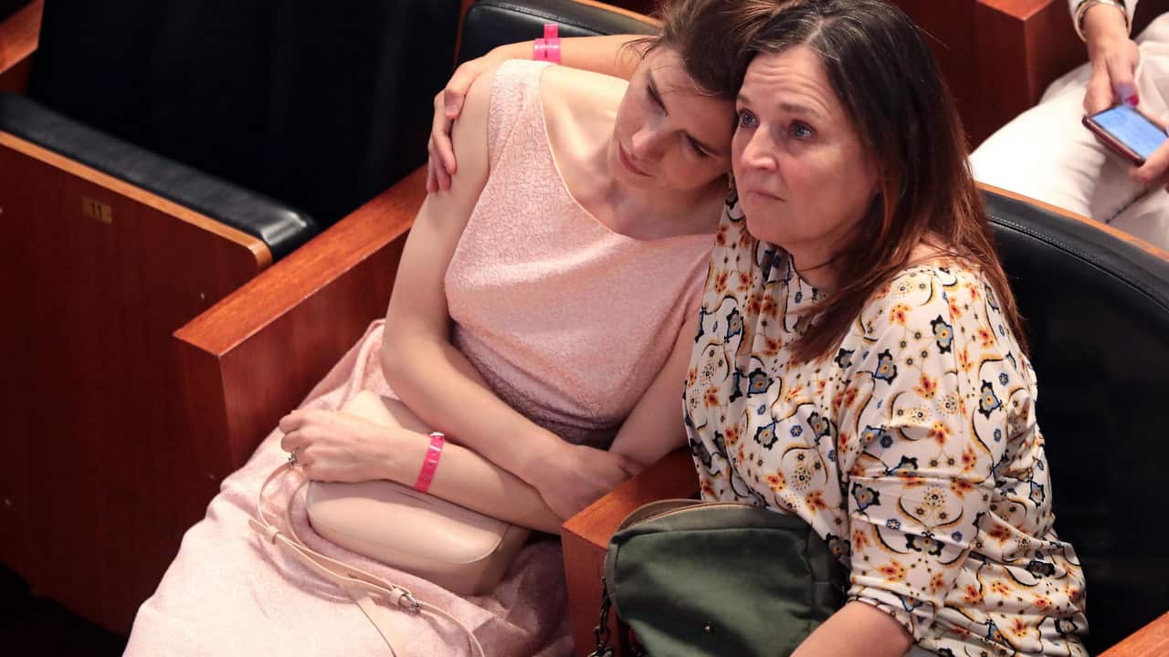 Amanda Knox (L) with her mother, Edda Mellas (R), attend the conference of the Criminal Justice Festival at the University of Modena, Italy.