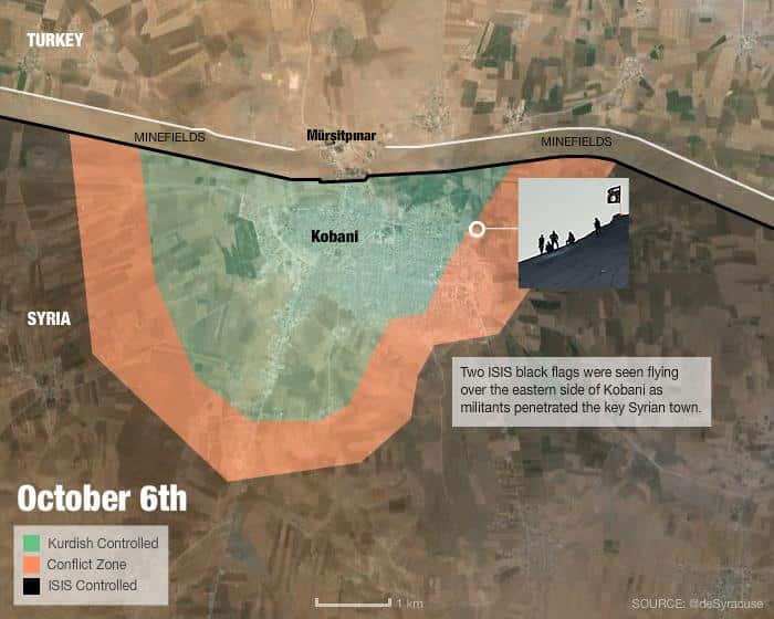October 6, 2014: Two ISIS black flags were seen flying over the eastern side of Kobani as militants penetrated the key Syrian town. (SBS)