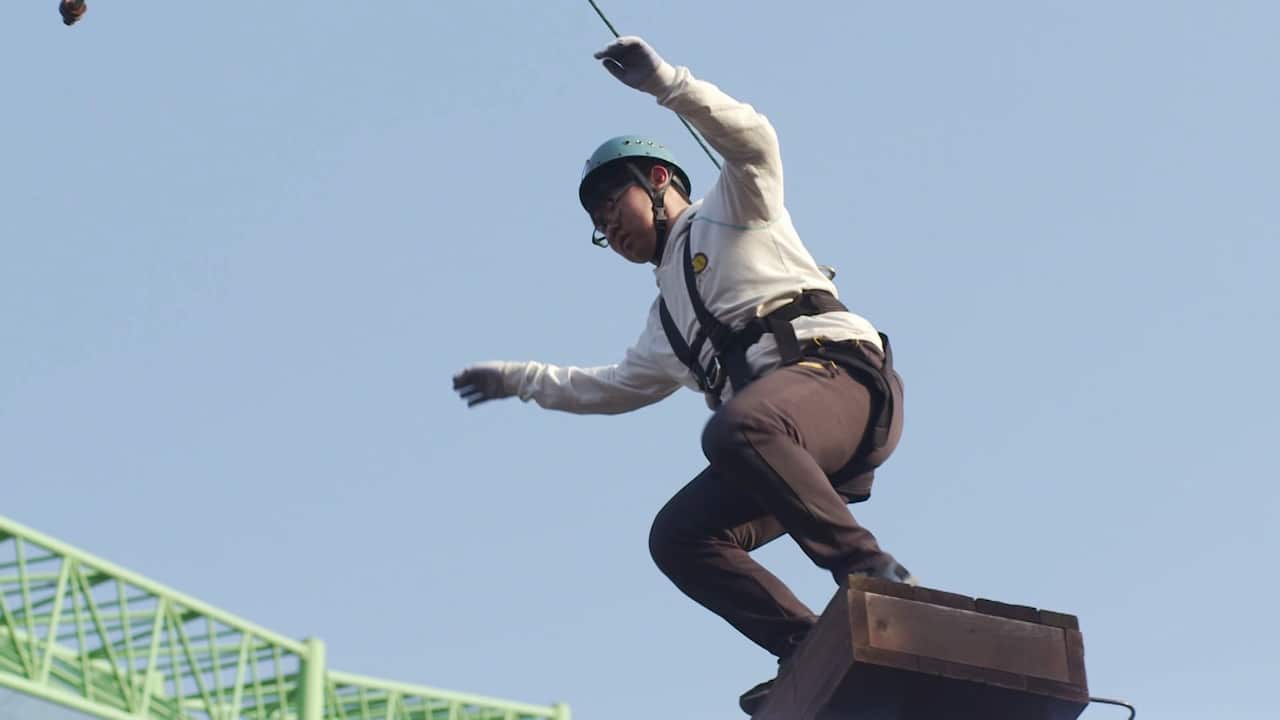 Soo In prepares to jump during a physical exercise session at the camp - a crucial part of teaching the difference between risks in the virtual and real worlds.