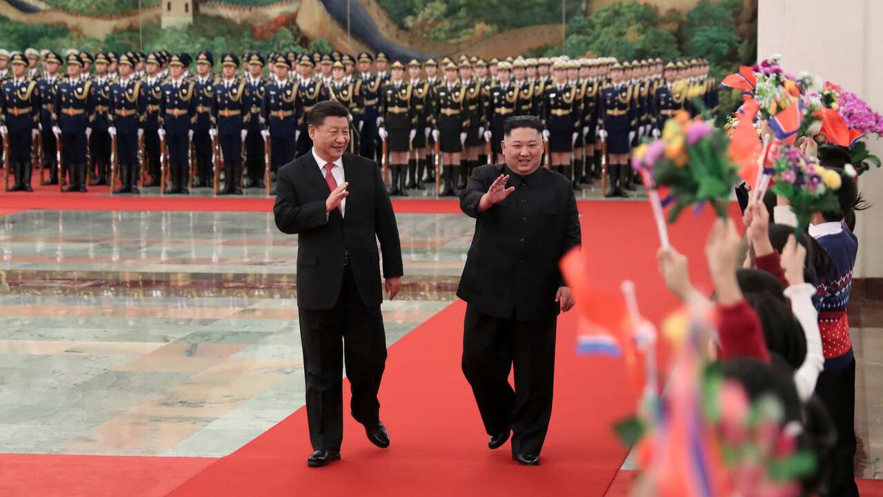 North Korean leader Kim Jong Un is cheered by children during a welcome ceremony in Beijing held by Chinese President Xi Jinping on 8 January, 2019.