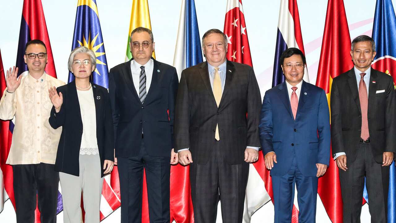 World leaders pose for a photo during the East Asia Summit Foreign Ministers Meeting in Singapore.