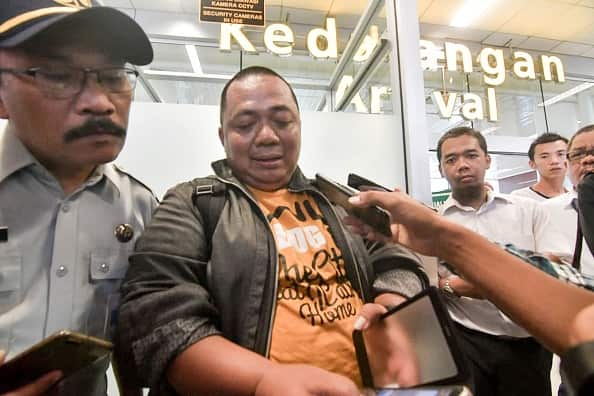 A distraught Sony Setiawan speaks to journalists. Setiawan was due to board the ill-fated Boeing-737 MAX but was held up on his commute.